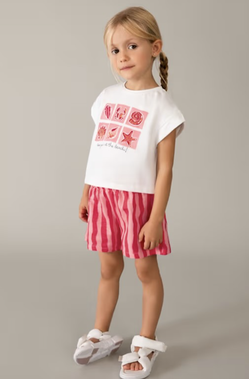 Girls beach-inspired short set in white and pink.